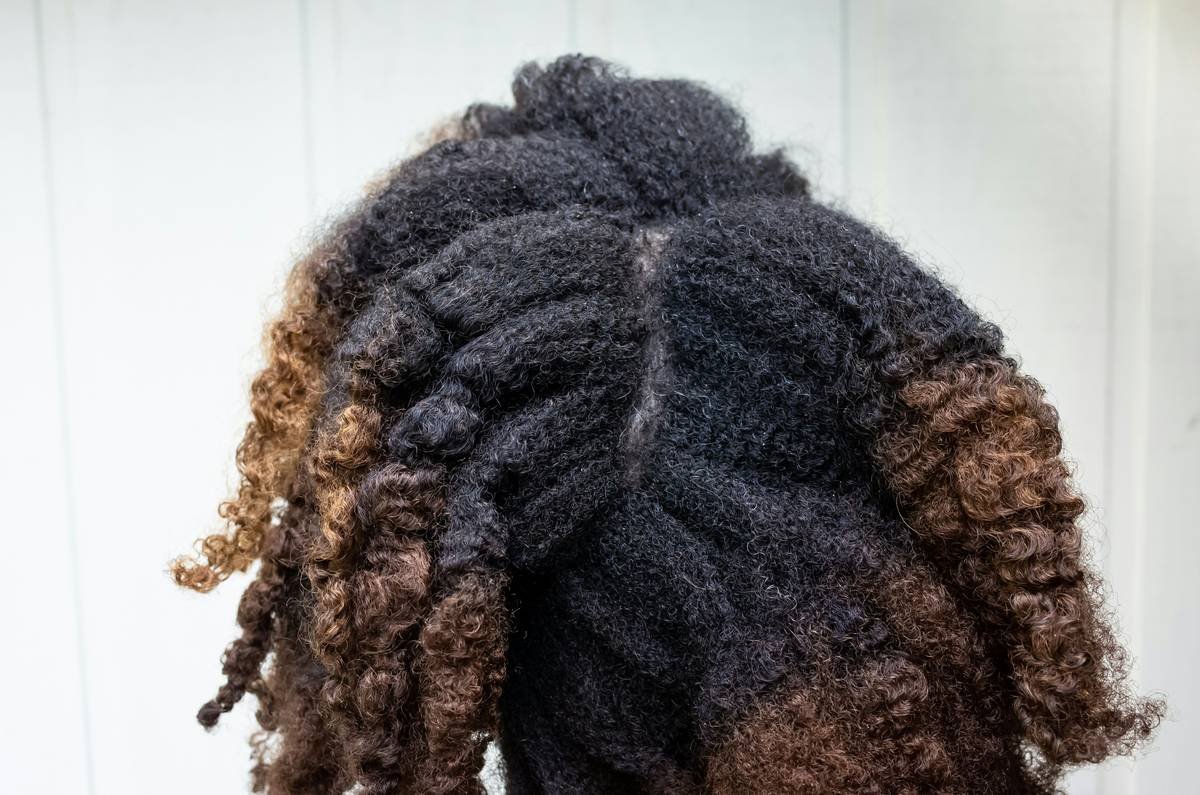 Side-by-side comparison: left shows messy, sagging bun on oily hair; right shows neat, full bun with textured roots and satin scrunchie